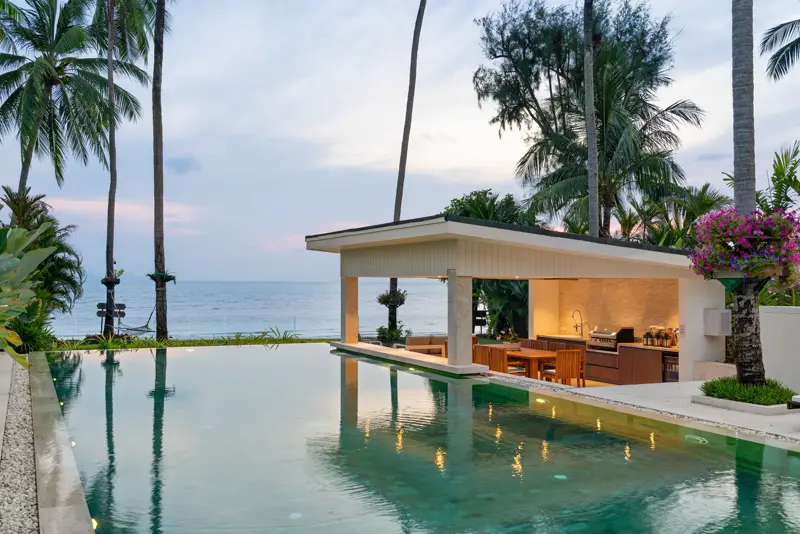 The open dining sala at sunset with the sea and islands beyond.