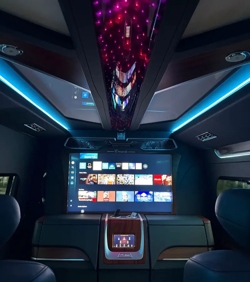 Inside Mandarin Beach Villa’s VIP van: a starlight ceiling, blue light strips and the large screen between the rear seats.