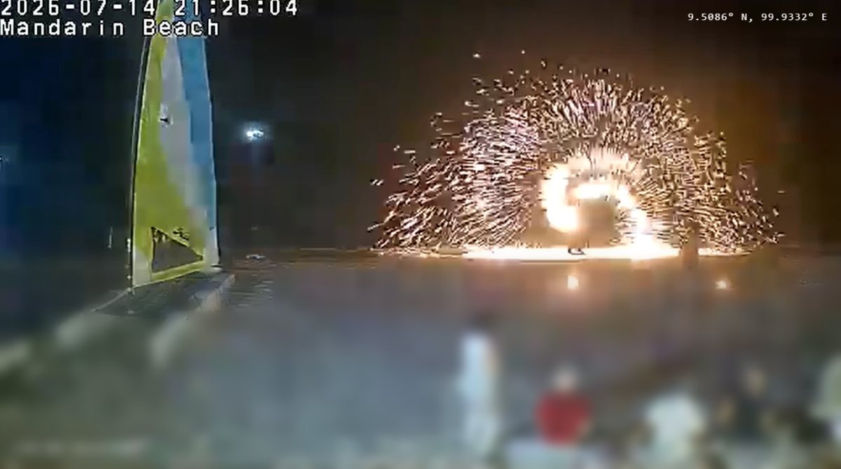 Fireworks bursting over the sand in front of Mandarin Beach Villa's beachfront on Lipa Noi, captured on the live webcam at 21:26 on 14 July 2026