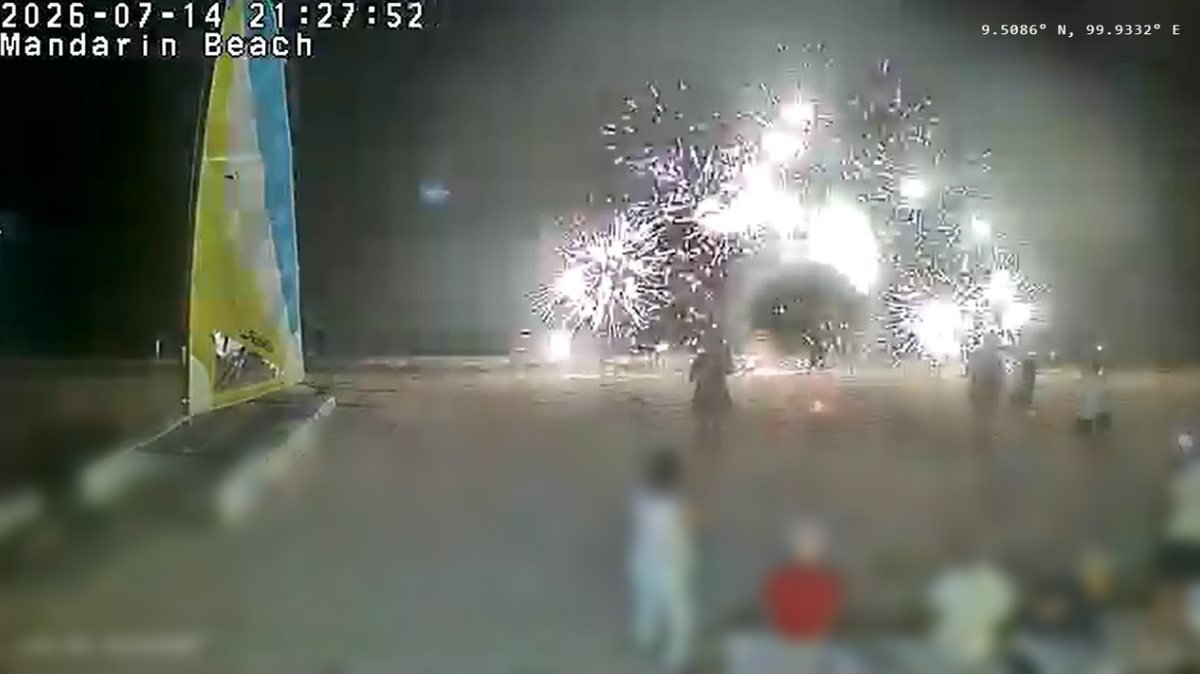 Multiple fireworks over the beach with guests watching from the shore at Mandarin Beach Villa, Lipa Noi, captured on the live webcam at 21:27 on 14 July 2026