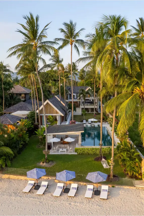 Aerial view of luxury beachfront family estate with private pool, gardens and beach access in Koh Samui.