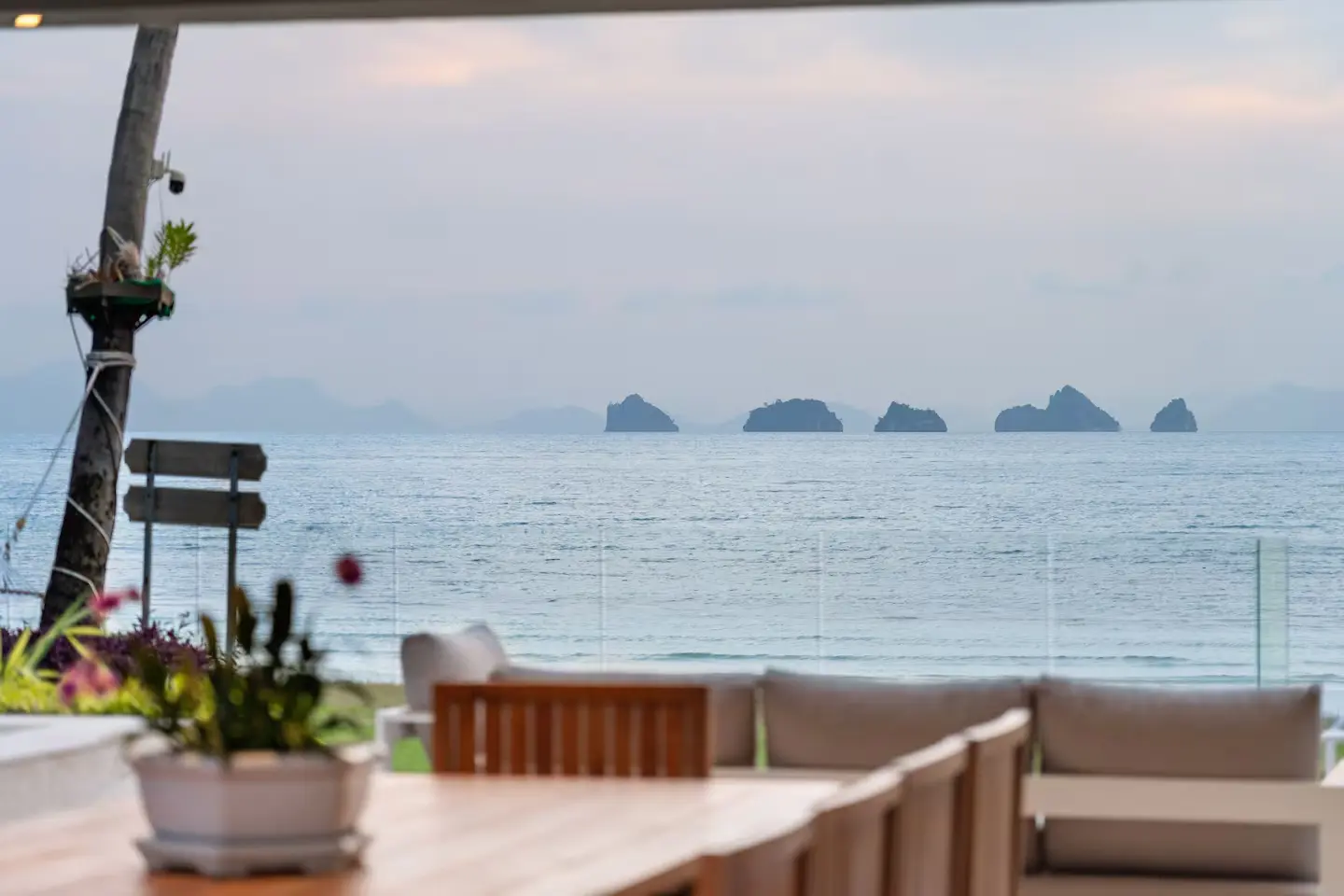 Luxury beachfront family dining area overlooking the sea at Mandarin Beach Villa Koh Samui.