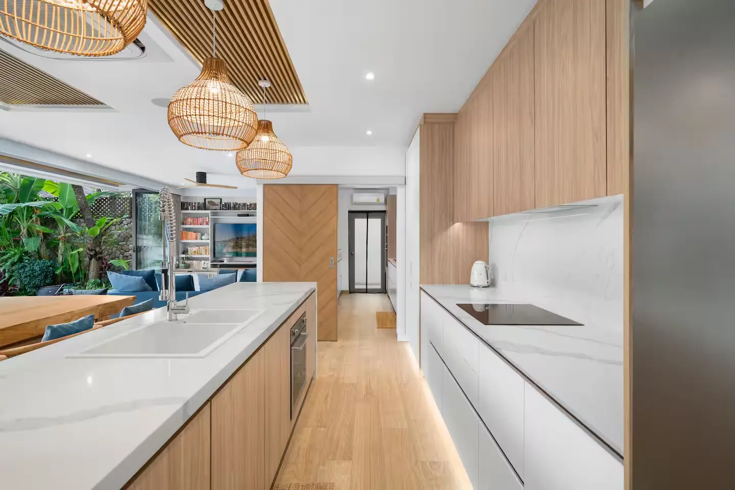 Separate guest and chef kitchens designed for luxury family entertaining at Mandarin Beach Villa Koh Samui.