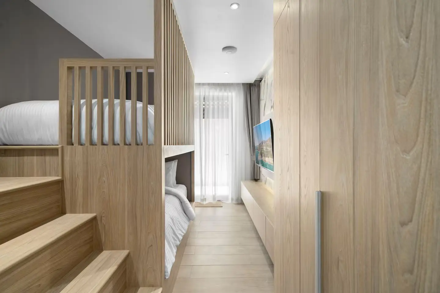 Luxury children’s bedroom with TV and gaming area at Mandarin Beach Villa Koh Samui.
