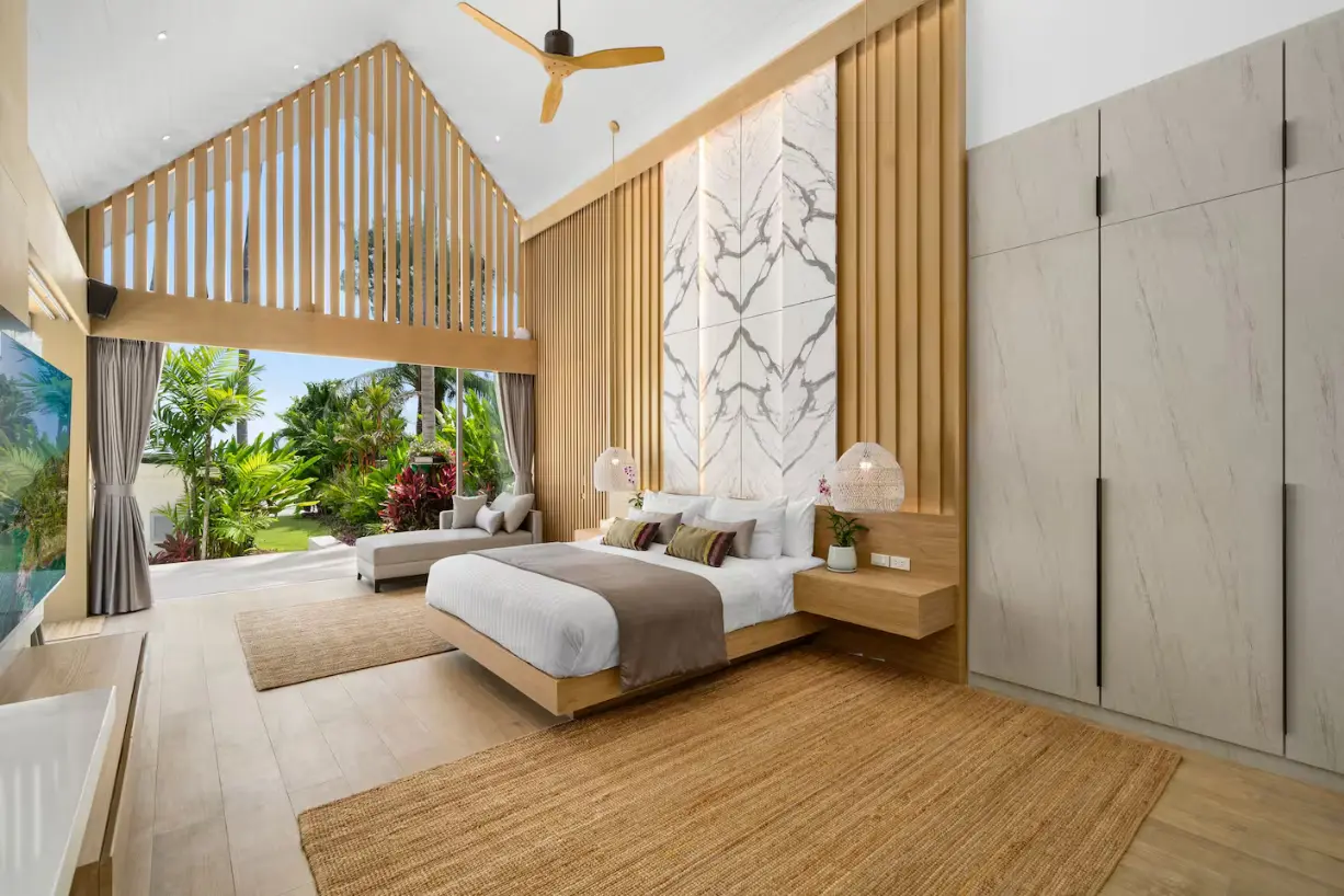 Luxury beachfront family bedroom with direct ocean views at Mandarin Beach Villa Koh Samui.