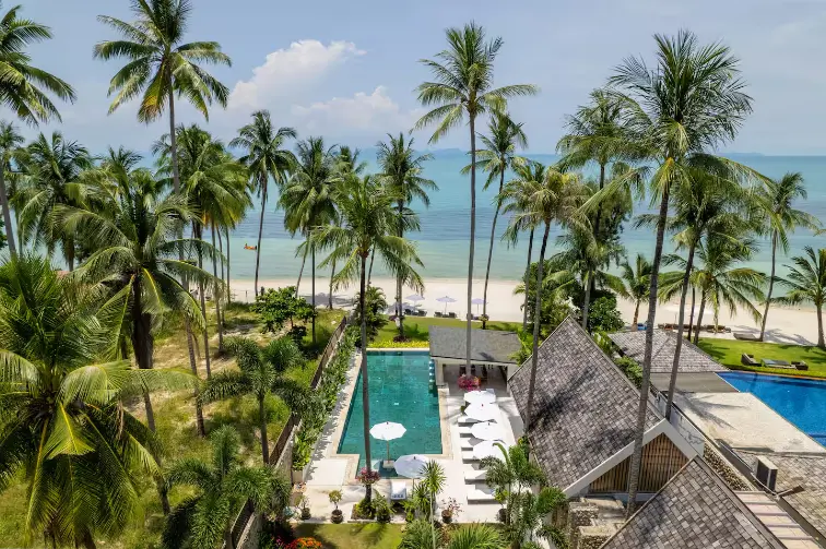 Rear tropical gardens, beachfront pool and sea views at Mandarin Beach Villa Koh Samui.